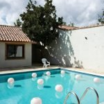 How to Design a Stunning Backyard Pool at Your Farmhouse That Adds Value